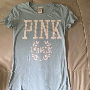 Two pink branded shirts sizes are small and medium